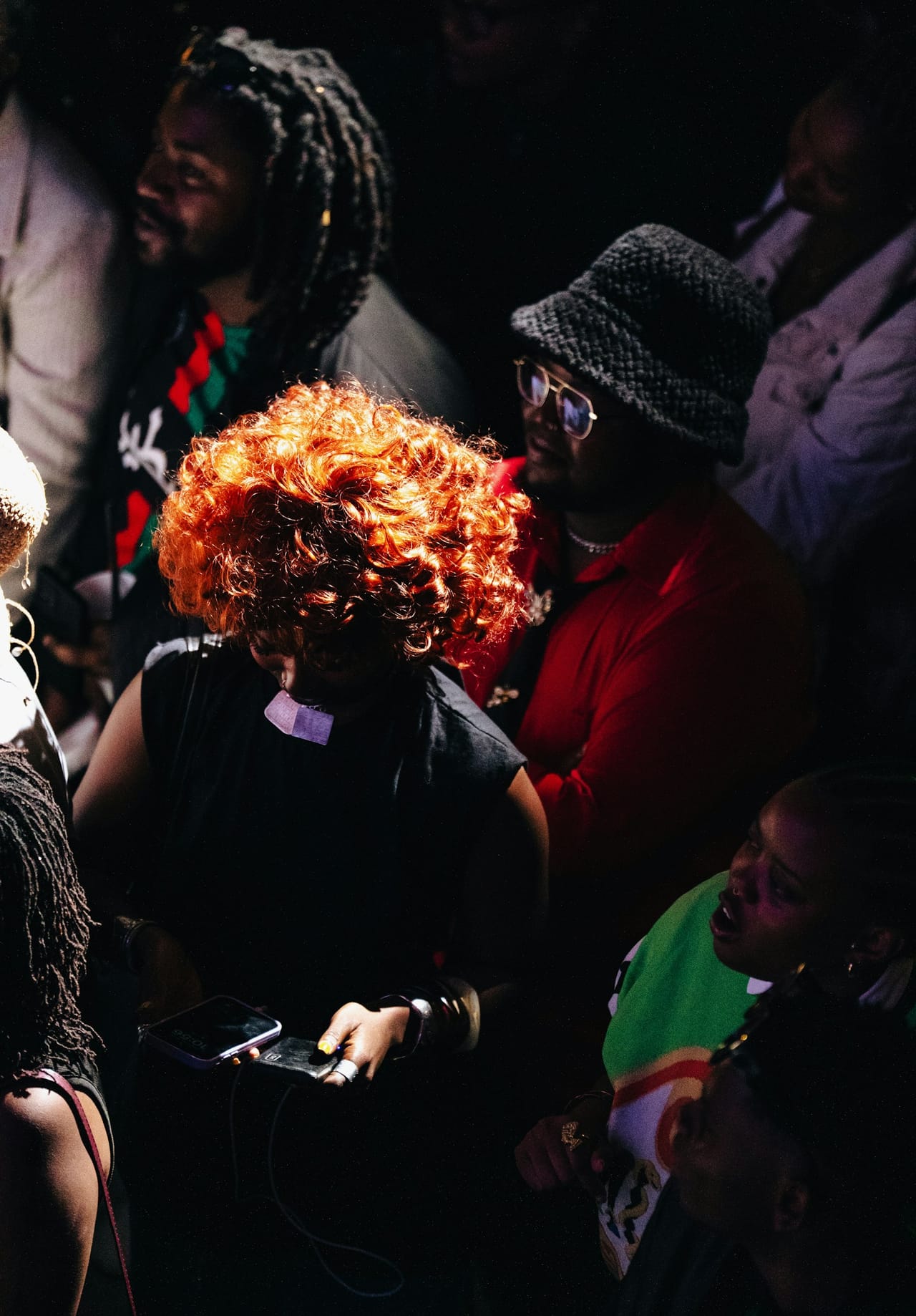 Partygoers in a dark room