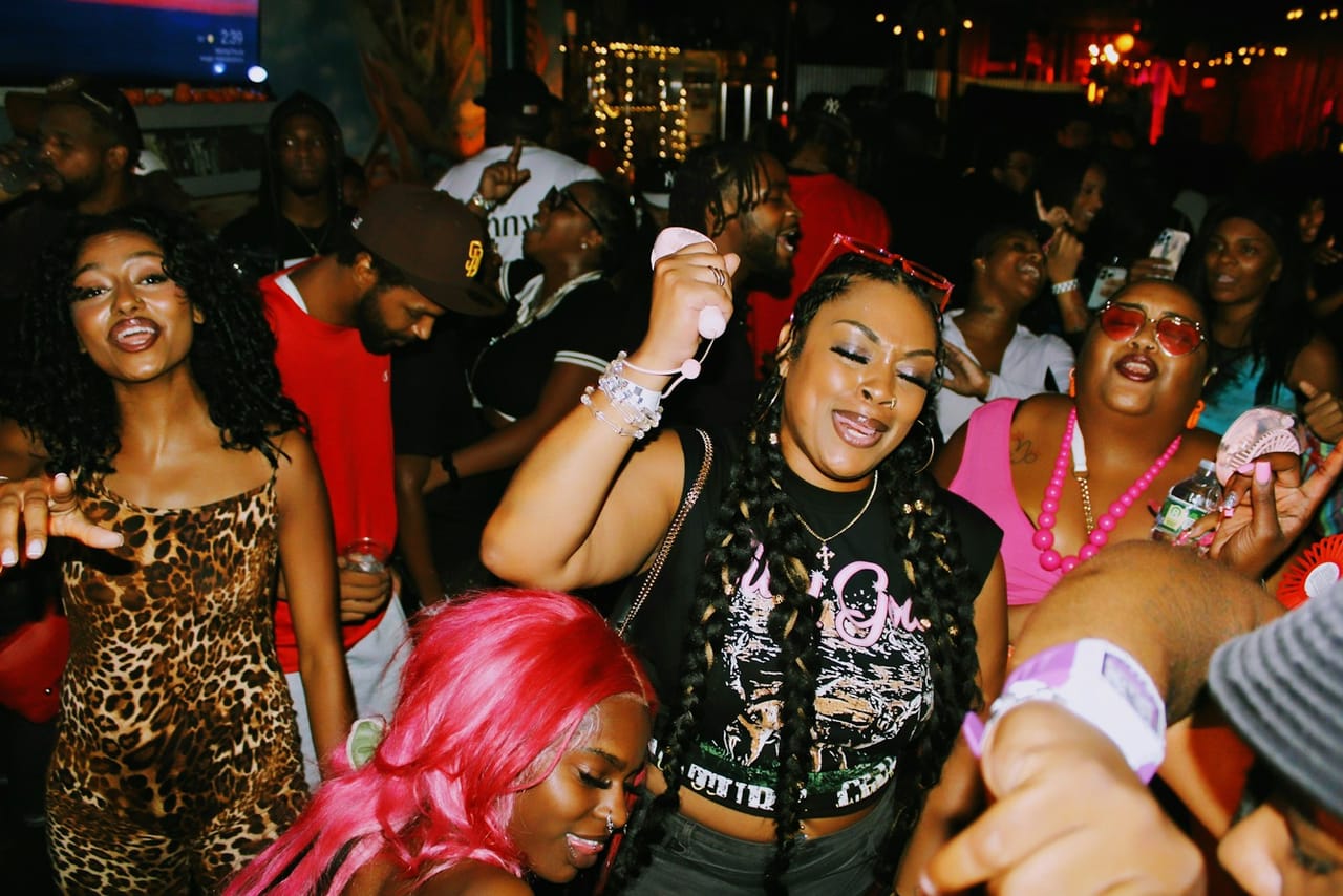 Crowd dancing at a packed night party